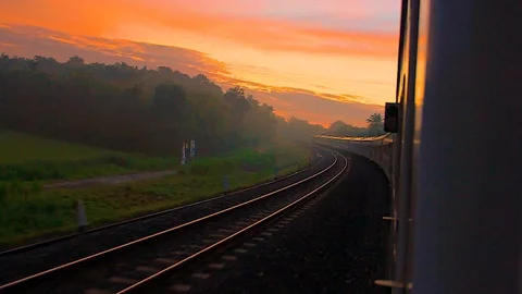 Sunset time journey on a train Stock Footage 105179220