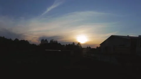 Sunset in time laps mode, village, stable, red sun Vidéo 132293929