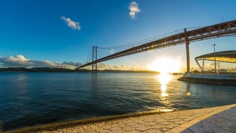 Sunset time-lapse of the 25th of April Bridge in Lisboa Stock Footage 90258104