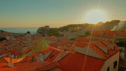 Sunset time lapse above house roof in Mediterranean old town Dubrovnik protected Stock Footage 72445022