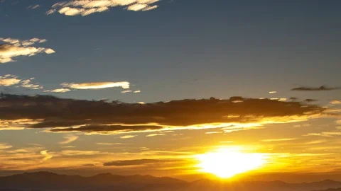 Sunset time lapse above a mountain range in the far distance Stock Footage 92877057