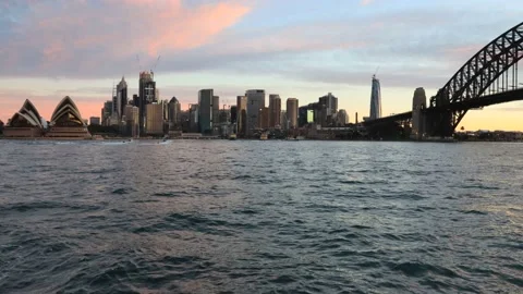 Sunset time lapse across Sydney harbour with city CBD landmarks in 4k. Stock Footage 135498264