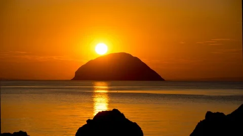A sunset time lapse at the Ailsa Craig, south west Scotland Stock Footage 90949478