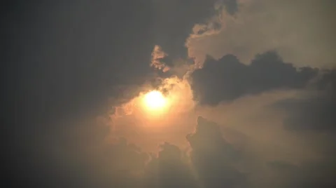 Sunset time lapse behind the cloud zoom in sunny sky in summer Stock Footage 66789520