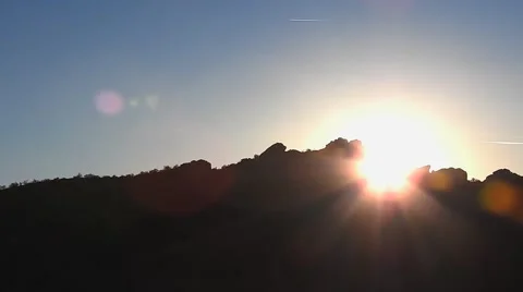Sunset Time Lapse Behind a Desert Canyon Stock Footage 62493539