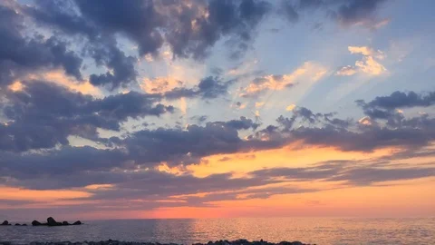 Sunset time lapse of boat passing in front of the beach. Stock Footage 126094711