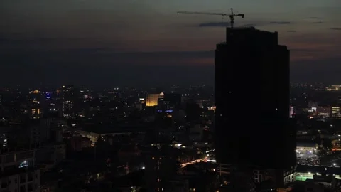 Sunset time-lapse, Building night view with crane Stock Footage 207622438