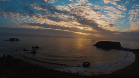 Sunset time lapse captures shifting clouds over the Pacific at Goat Rock Stock Footage 327170824