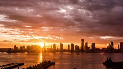 A sunset time lapse of the jersey city skyline from manhattan Stock Footage 215322714