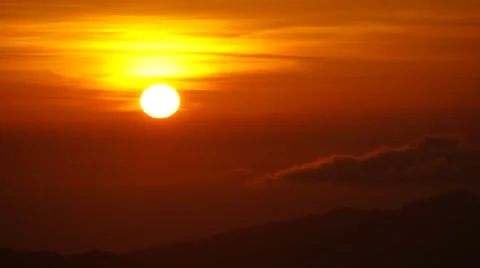 Sunset time lapse of large sun over rolling clouds Video stock 48958385