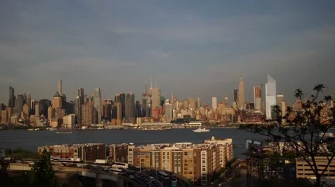 Sunset Time-Lapse of Manhattan with Heavy Traffic from and Moon Rising Video stock 63637330