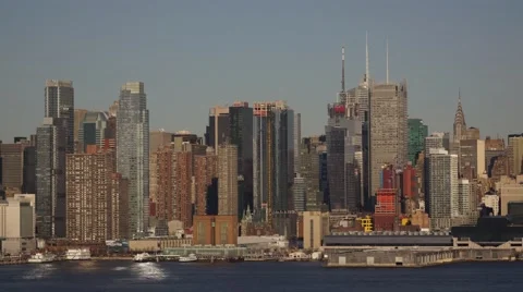 Sunset Time-Lapse of Midtown Manhattan with Moon Rise and Boat river Traffic Stock Footage 62528860