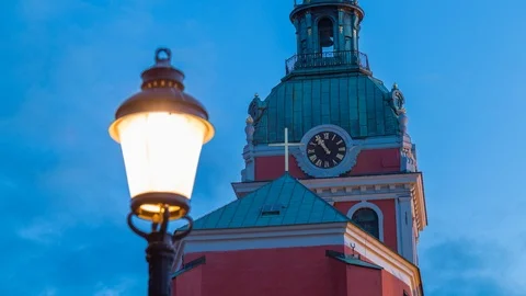 Sunset Time lapse of an old church clock in Norrmalm Stockholm, Sweden Stock Footage 95979688