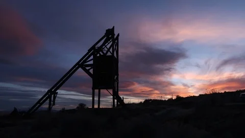 Sunset Time Lapse of old mining head frame in ghost town. Stock Footage 95876160