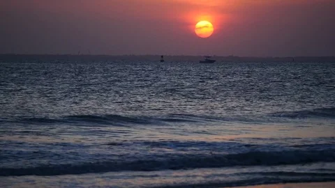 Sunset time-lapse over harbor waves Video stock 77839964
