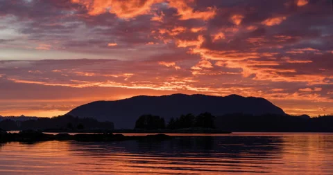 Sunset time lapse over mountains and ocean Stock Footage 165244413