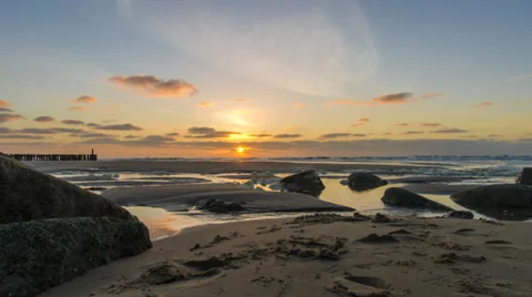 Sunset time lapse over a rocky, sandy beach -  24 FPS timelapse  Stock Footage 37360147