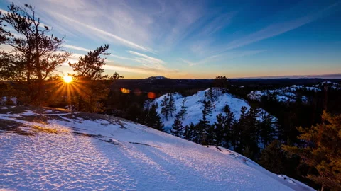 Sunset time-lapse over snow covered hills, Upper Peninsula of Michigan 4K Stock Footage 219629256