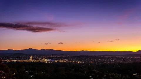 Sunset Time lapse over tiny city Stock Footage