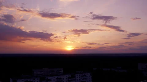 Sunset time lapse, red sunlit sky with dramatic clouds, beautiful background Stock Footage 135682691
