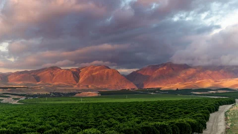 Sunset Time lapse with River Canyon and Orchards Stock Footage 253845257