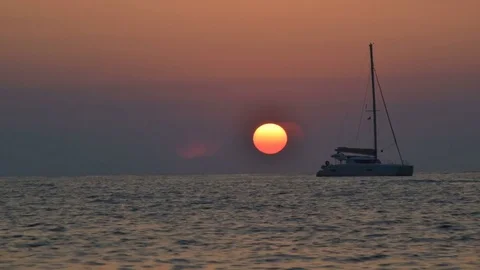 Sunset time lapse on the sea with katamarano Stock Footage 83132520