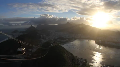 Sunset time lapse with sugar loaf cable car passing by above bay Stock Footage 50939918