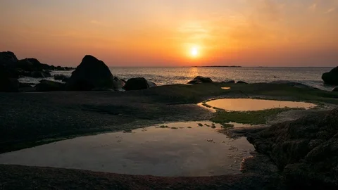 Sunset time lapse by a tide pool at Uttakleiv Beach Stock Footage 112719392