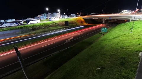 Sunset time-lapse of vehicle traffic at the intersection of highways Stock Footage 328484753