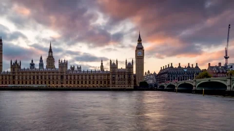 Sunset time lapse view of the Westminster Parliament and Big Ben Tower in London Stock Footage 312161937