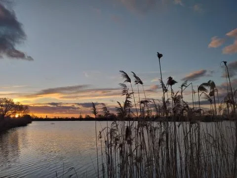 Sunset time over lake Stock Photos