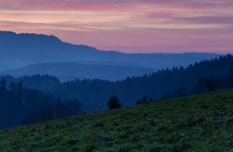 Sunset time over low mountains Stock Photos