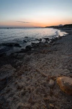 Sunset time in Santo Tomas beach on the island of Menorca. Stock Photos