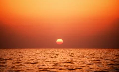 Sunset time at a sea Stock Photos