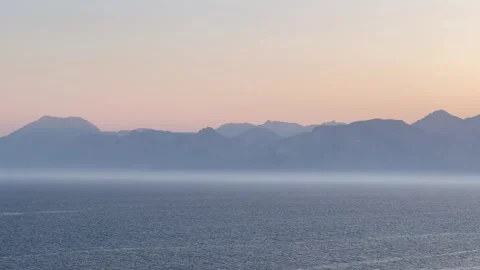 Sunset time by the sea under colorful sky over blue sea Stock Footage 336947762