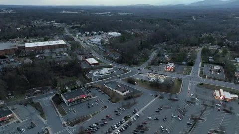 Sunset time in suburb of American town in spring. Aerial wide shot. Parking Stock Footage 304852181