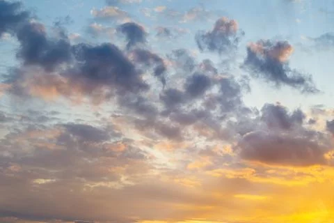 Sunset time, summer mood. Sunlight and sun rays break through the clouds Stock Photos