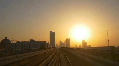 Sunset time sun light dubai city metro ride front panorama 4k uae Stock Footage 75938922
