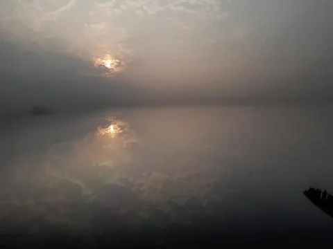 Sunset time sunlight and cloud sky reflection. Stock Photos