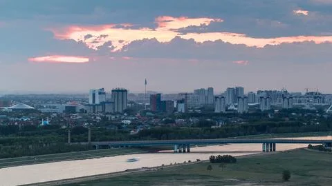 Sunset timelapse above the Bridge over the river with the transport and cloud Stock Photos