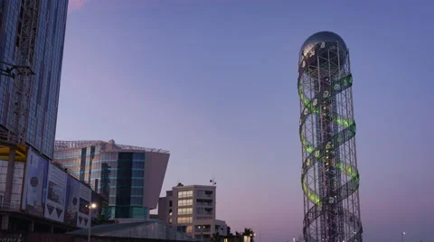 Sunset timelapse of Alphabet Tower in Batumi, zoom in Stock Footage 61544372