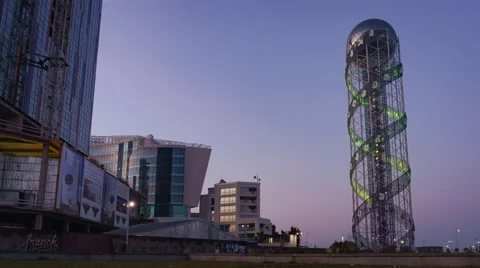 Sunset timelapse of Alphabet Tower in Batumi, pan zoom Stock Footage 61544393