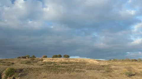 Sunset timelapse and moving storm clouds over the farm fields Stock Footage 31177820