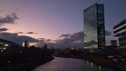 Sunset timelapse and office buildings in Osaka, Japan - 4k Stock Footage 299762635