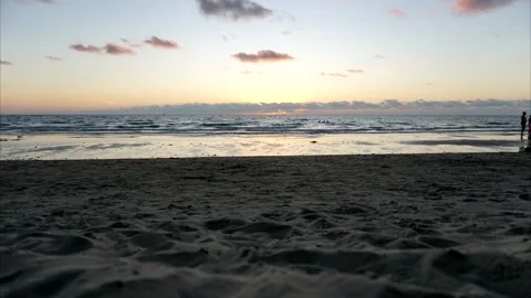 Sunset timelapse on the beach. People are resting. Video stock 146512785