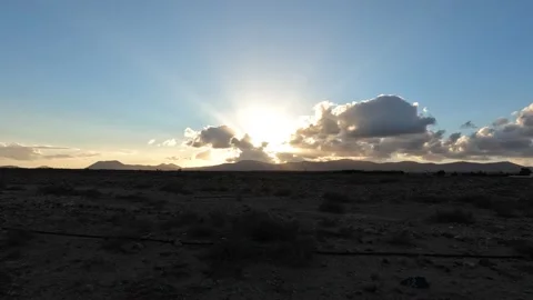 Sunset timelapse behind moving clouds leads to beams of light Stock Footage 175694291