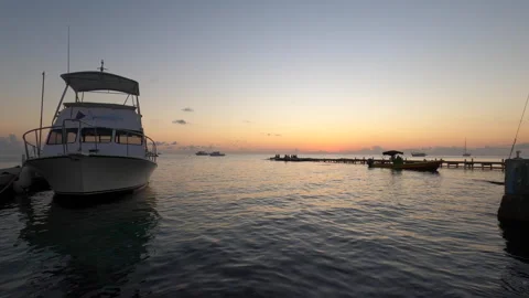 Sunset timelapse of boat docked on pier in the Caribbean Stock Footage 243182462
