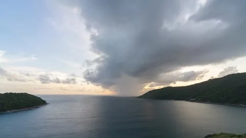 Sunset timelapse at Cape Krathing with stormy clouds and rain sweeping across Stock Footage 317937865