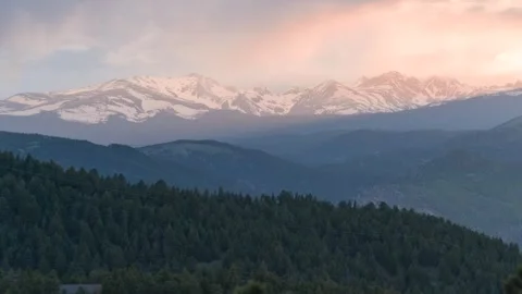 Sunset Timelapse of a Cloudy Rainstorm over the Rocky Mountains (2023| 4K) Stock Footage 242440610