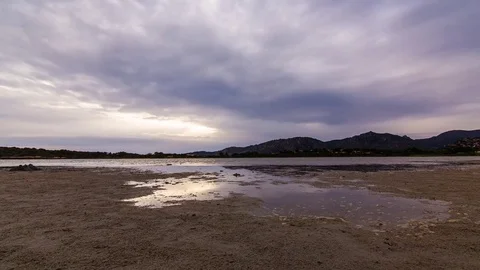 Sunset Timelapse cloudy with reflection and flare 4K Vídeos de archivo 82930578